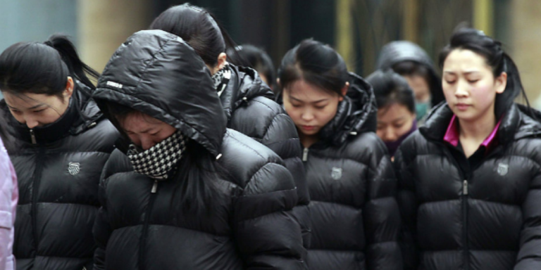 5c5d9ec 1708771537583 north korean women with their heads down