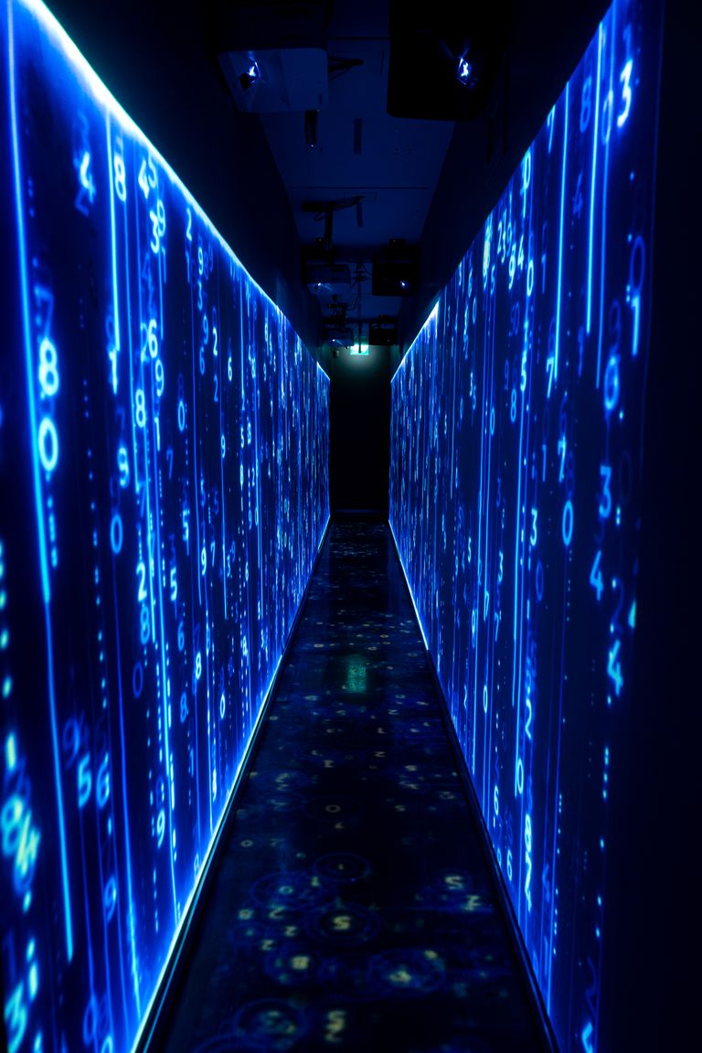 A luminous blue tunnel with digital numbers creating a futuristic, sci-fi ambiance.